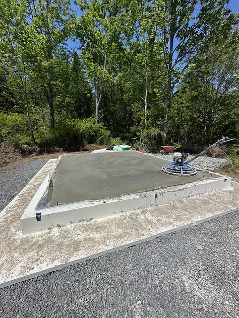 Finished concrete slab curing in the forms