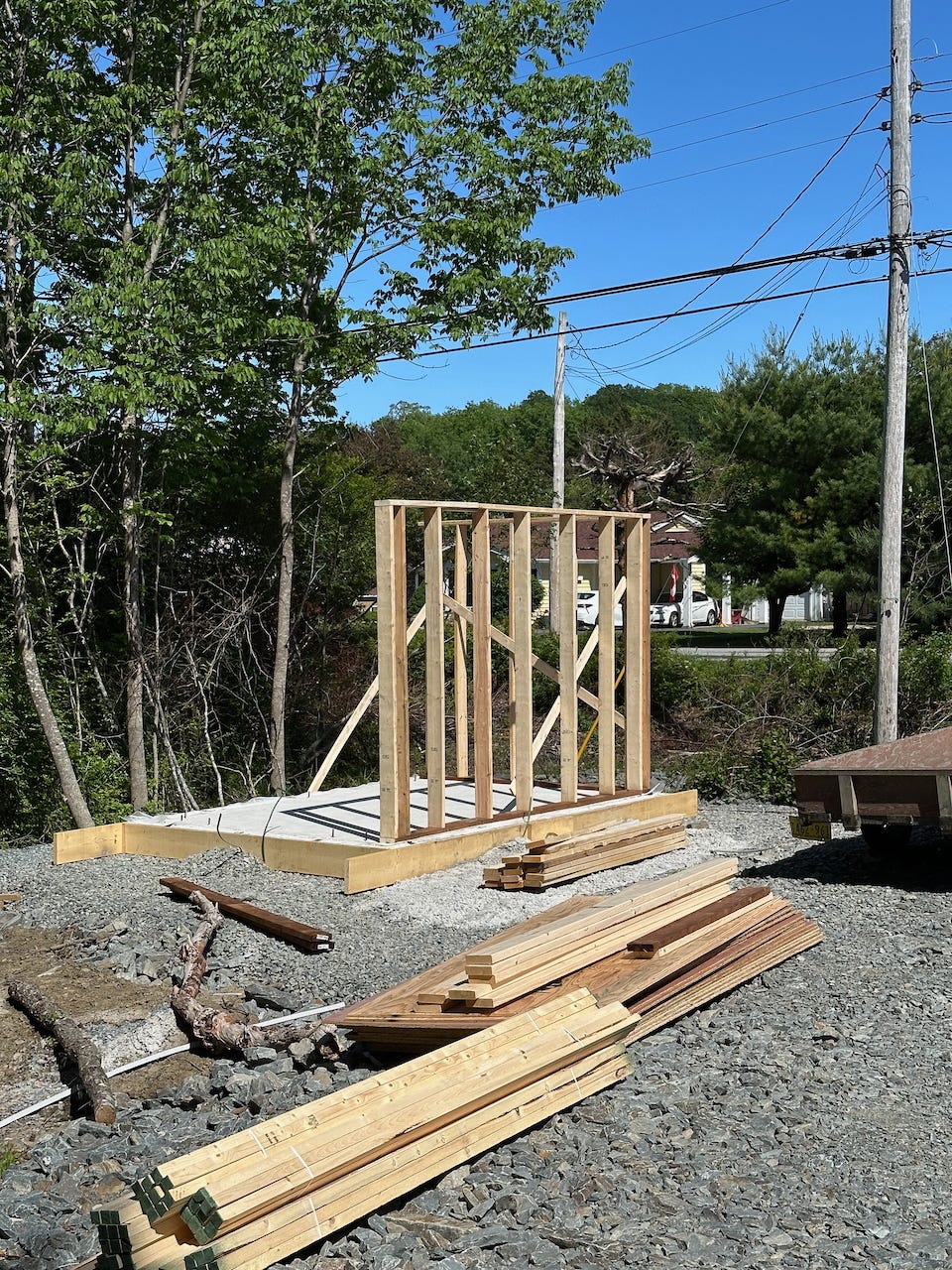 Three framed walls propped up on the slab with temporary bracing