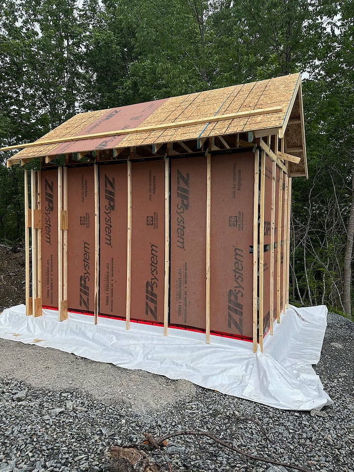 Larsen trusses being added to the outside of the walls